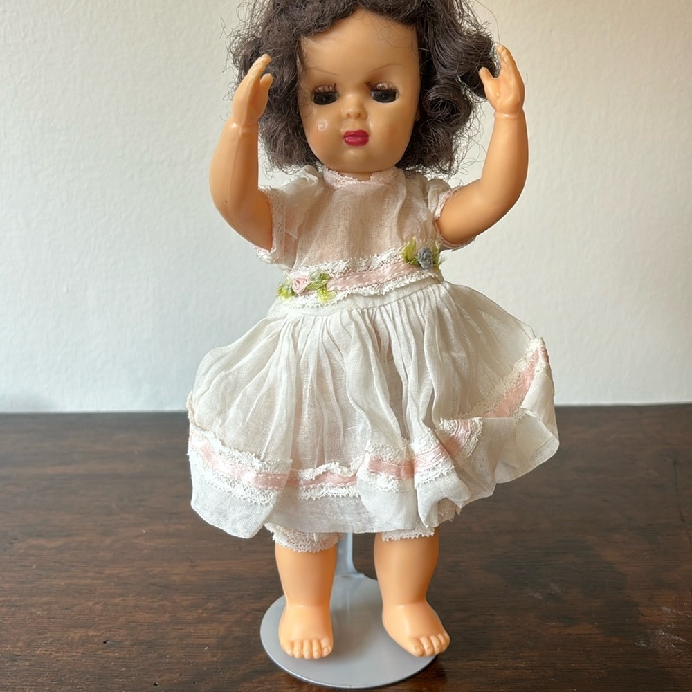 Vintage Doll with White Dress and Pink Accents
